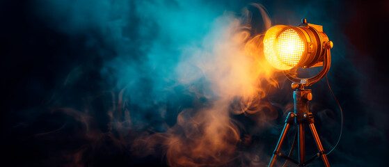 Vintage spotlight on a tripod enveloped in atmospheric smoke against a dark blue background, capturing a creative concept. Generative AI