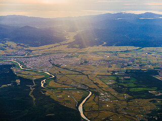 A bird’s-eye view from the plane at sunset in early autumn over the central part of the Ishikari...