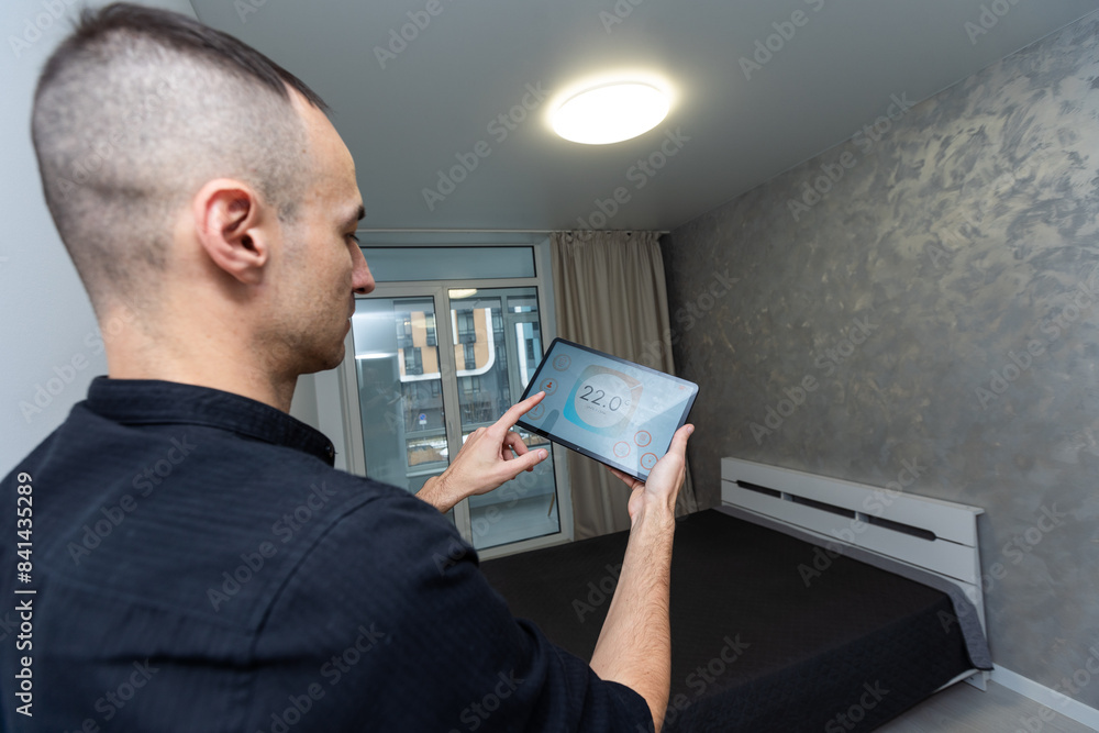 Aufkleber man using smart home security system control panel