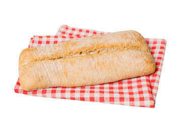 Freshly baked delicious french bread with napkin isolated on white background top view. Healthy white bread loaf