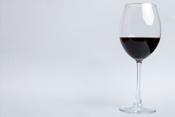 One glasses of red wine at wine tasting. Concept of red wine on colored background. Top view, flat lay design