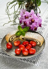 Home baking - sweet poppy seed strudel with cherries,
afternoon dessert with tea or coffee.