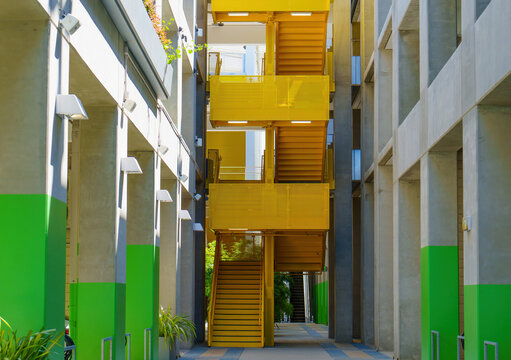 Modern Building with Yellow Staircases and Green Accents