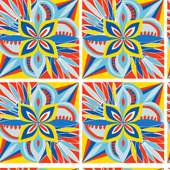 Vector geometric pattern in Sicilian majolica style with geometric patterns of plants and flowers in blue yellow orange shades