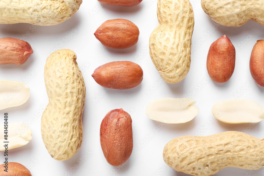 Wall mural Fresh peanuts on white background, flat lay