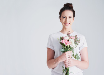 Happy woman, portrait and plant with flower bouquet for gift, valentines day or anniversary on a white studio background. Female person or model with smile for natural leaves, bloom or love on mockup