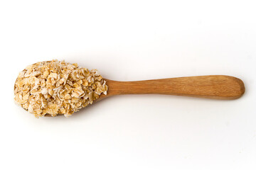 Top view of instant oatmeal on spoon isolated on white background. Oatmeal is oats that have been ground or processed, cooked quickly within a few minutes, add hot water or warm milk.