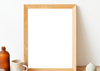 Picture frame mockup on a wooden sideboard table