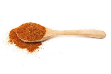 Wooden spoon of Paprika powder isolated on white background. Sweet Red Chili Powder. Paprika Powder for Garnish, Season, make spice rubs or marinades.