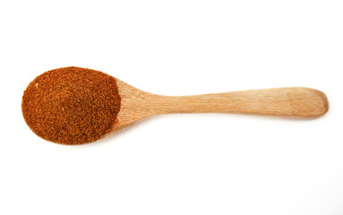 Top view of wooden spoon of Paprika powder isolated on white background. Sweet Red Chili Powder. Paprika Powder for Garnish, Season, make spice rubs or marinades.