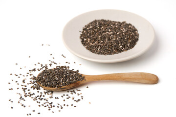 Chia seed on spoon and dish isolated on white background. Chia Seed is a small grain. will swell when soaked in water. many nutrients Contains omega-3, protein, fiber and vitamin.