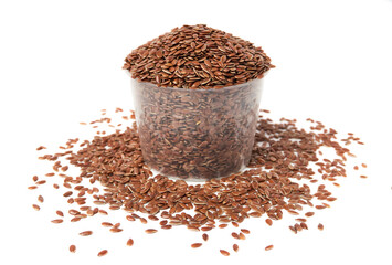 Bowl of Brown flax seeds and scattered isolated on white background. Brown Flax Seed is rich in nutrients such as dietary fiber and essential fatty acids that are beneficial to the body.