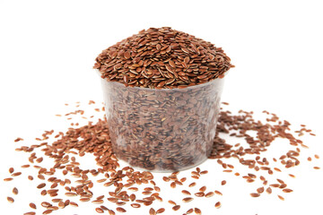 Bowl of Brown flax seeds and scattered isolated on white background. Brown Flax Seed is rich in nutrients such as dietary fiber and essential fatty acids that are beneficial to the body.