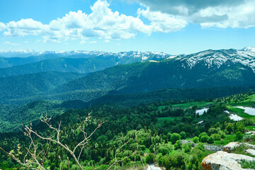Naklejka premium View of mountains in summer and snowy peaks.
