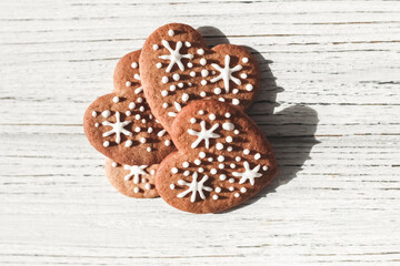 Homemade cookies in the shape of hearts with snowflakes