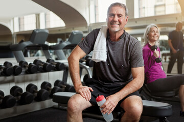 Sports, gym and portrait of senior man with water bottle for training, exercise and workout. Fitness, retirement and person resting with towel, liquid and drink for wellness, health and hydration - Powered by Adobe