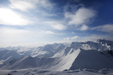 Fototapeta premium Snowy mountains in evening