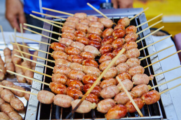  I-san pork meat sausage grilling on barbecue grill