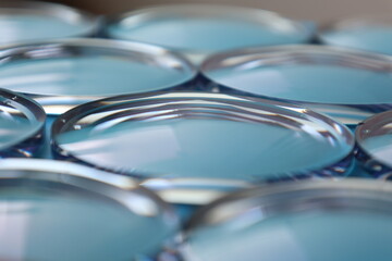 Eyeglasses lens production industry, close-up eyeglasses lenses, Glasses lenses, eyeglasses lenses, eyeglasses store business concept