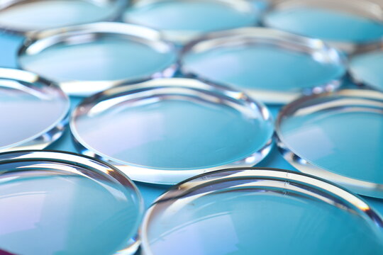 Eyeglasses lens production industry, close-up eyeglasses lenses, eyeglasses lenses, eyeglasses lenses, eyeglasses store business concept