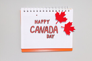 The inscription Happy Canada Day in a notebook