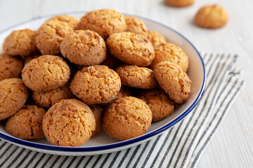 Homemade Sweet and Crunchy Amaretti on a Plate, side view. Close-up.