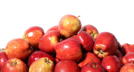 Pile of fresh apples with water drops isolated on white