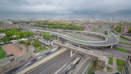 Traffic jams of roadside, transportation motion in a big city. Rush hour traffic on a city roads aerial timelapse.