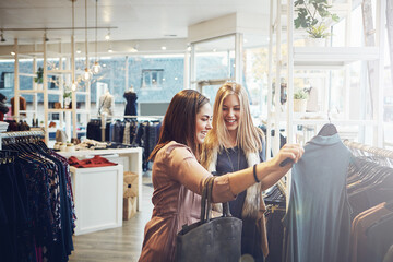 Happy, shopping and help customer with clothes for decision, sales or discount at luxury mall....