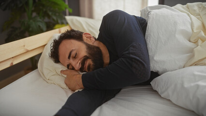 A content mature bearded man relaxing in a cozy bedroom setting, emanating tranquility and comfort.