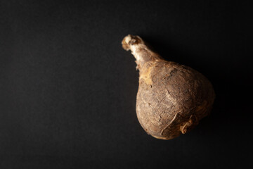 A pile of Dry Organic Wild onion or Indian squill (Drimia indica), isolated on a black background. Top view.