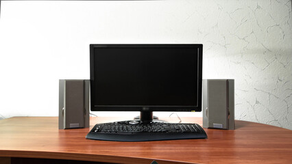 Fototapeta premium Work desk for digital job with computer, audio speakers and keyboard timelapse hyperlapse