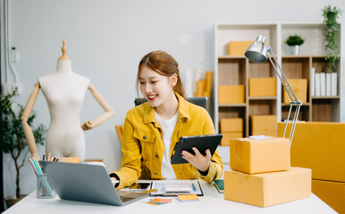 Fashion blogger concept, Young Asian women selling clothes on video streaming.Startup small...
