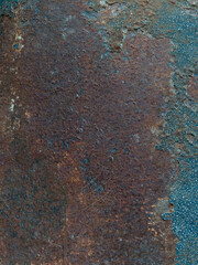 Rust on the steel wall looks like an art painting. On the right side there was a small ball hanging down. The left side has a large rust stripe.
