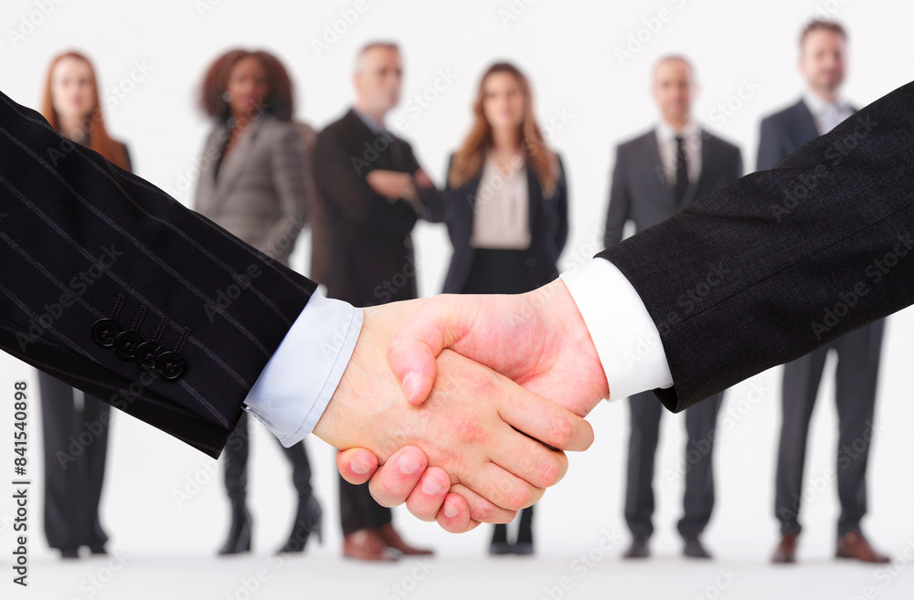 Poster a close-up of a handshake with blurred businesspeople in the background, concept of partnership. gen