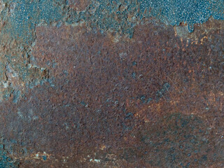 Rust on the steel wall looks like an art painting. On the right side there was a small ball hanging down. The left side has a large rust stripe.