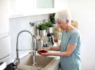 kitchen food woman healthy morning mature fruit water sink washing organic clean hygiene freshness preparation cleaning wash ingredient breakfast active diet home eating