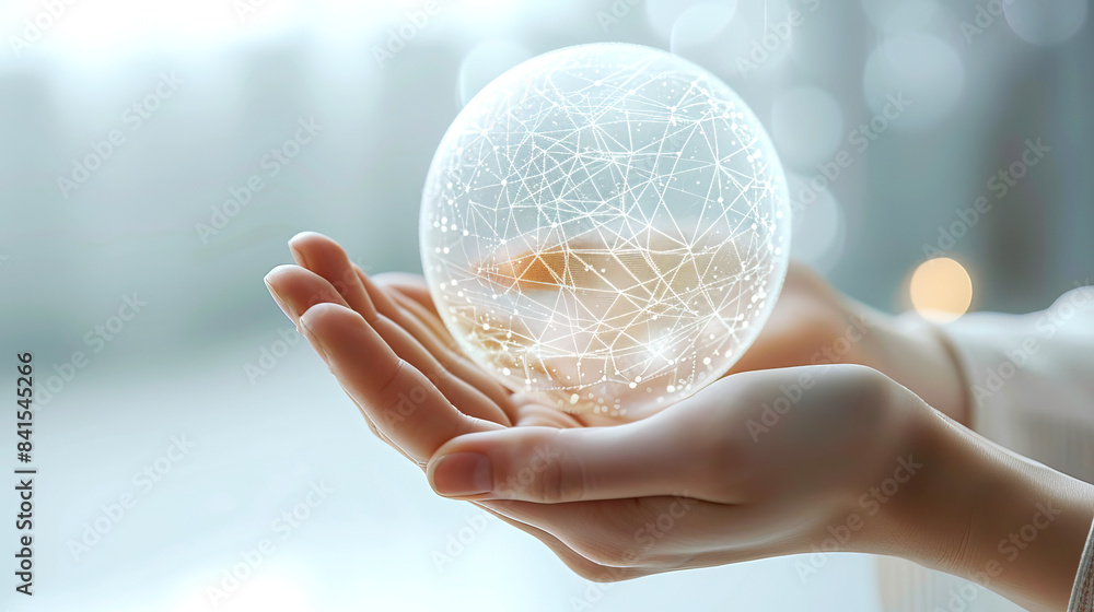Aufkleber a hand holding a glowing transparent sphere with a network pattern, set against a blurred light back