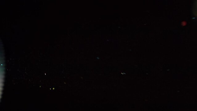 The movement of dust particles and dust particles, the effect of dynamics. Isolated black background, overlay layout for your design. High quality 4k footage