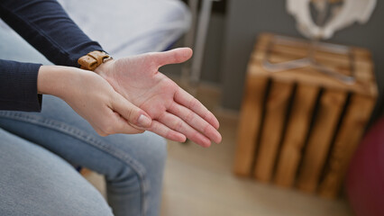 Obraz premium Close-up of a woman's extended hand ready for a handshake in an office setting.