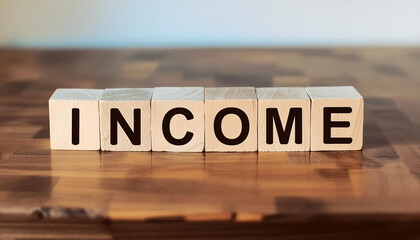 Wood cubes with text INCOME on table. Financial success and marketing. Saving money for the future
