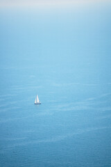 sailboat among the blue sea