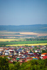 small house against the backdrop of fields
