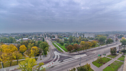 Obraz premium Road intersection with reconstructed tram tracks aerial panoramic timelapse.