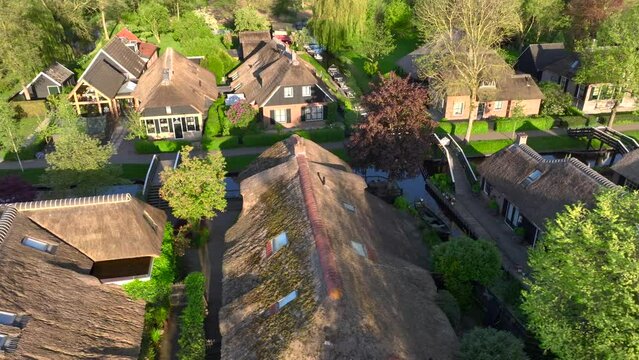 Close up od Old Thatched Roof Huts in Giethoorn, the Netherlands, Aerial Drone View. The most beautiful Dutch Village.