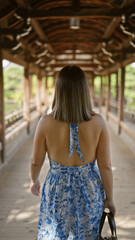 Portrait of a beautiful hispanic woman walking away, a back view of a casual walk at heian jingu, kyoto's traditional japanese shrine