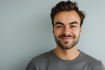 Obraz premium A close up portrait of a young man with a subtle smile