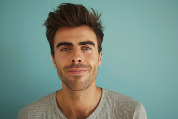 Obraz premium A close up portrait of a young man with a subtle smile