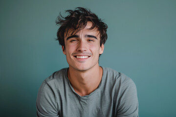 Fototapeta premium A close up portrait of a young man with a subtle smile