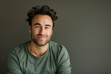 Fototapeta premium A close up portrait of a young man with a subtle smile